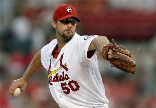 St. Louis Cardinals starting pitcher Adam Wainwright throws during the first inning of a baseball game against the Atlanta Braves, Friday, Aug. 23, 2013, in St. Louis. (AP Photo/Jeff Roberson)