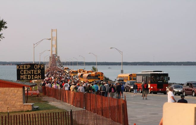 In this 2012 photo, thousands of Michiganders and visitors approach the north end of the Mackinac Bridge during the 55th annual Labor Day Mackinac Bridge Walk. This year's event begins at 7 a.m. on Monday, September 2.