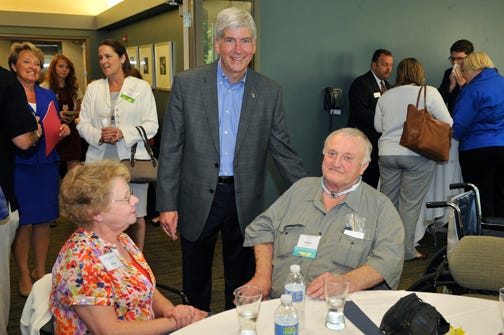 Loren Smith smiles with his sister, Mary, and Gov. Rick Snyder in Grand Rapids at the Governor’s Service Awards ceremony. Smith, a Sault Ste. Marie resident, was nominated for the “Volunteer of the Year” award.