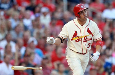 St. Louis Cardinals' Carlos Beltran tosses his bat after hitting a solo home run in the third inning of a baseball game against the Atlanta Braves, Saturday, Aug. 24, 2013, at Busch Stadium in St. Louis. (AP Photo/St. Louis Post-Dispatch, Chris Lee)