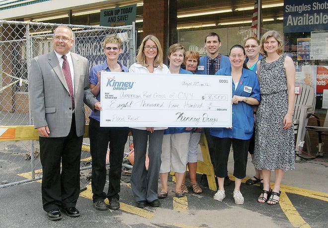 Kinney Drugs presented a check to the American Red Cross of the Mohawk Valley on Thursday to help with flood relief. The Little Falls store had to close for two days after flooding devastated the area earlier this summer. TELEGRAM PHOTO/STEPHANIE SORRELL/WHITE