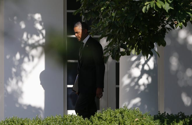 In this photo taken Aug. 22, 2013, President Barack Obama walks along the West Wing colonnade of the White House in Washington before traveling to New York and Pennsylvania. Nearly five years into his presidency, Obama confronts a world far different from what he envisioned when he first took office. U.S. influence is declining in the Middle East as violence and instability rock Arab countries. An ambitious attempt to reset U.S. relations with Russia faltered and failed. Even in Obama-friendly Europe, there's deep skepticism about Washington's government surveillance programs. (AP Photo/Charles Dharapak)