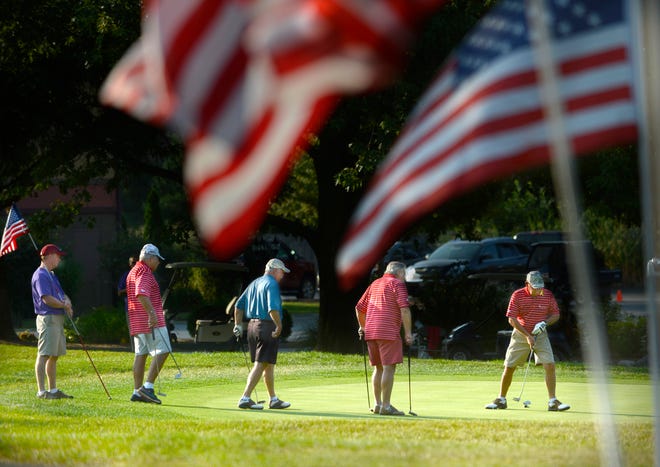 A group of veterans finish the first nine holes Monday at Mount Hawley Country Club in the annual Tee It Up for the Troops golf fundraising event. The men were part of the 480 veterans and active duty military from Illinois and several surrounding states who were players in the event split between Mount Hawley and the Country Club of Peoria.
