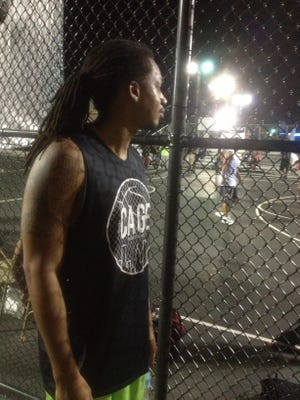 Avery Stevenson Jr. watches as teams play in The Cage downtown. Provided