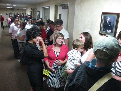 Dozens of same-sex couple line up outside the Albuquerque clerk’s office in New Mexico’s most populous county Tuesday, Aug. 27, 2013 before officials started issuing same-sex marriage licenses. The Bernalillo County Clerk joined clerks from the state’s other two population centers in recognizing same-sex unions after a judge Monday declared gay marriage legal in New Mexico. AP Photo/Russell Contreras