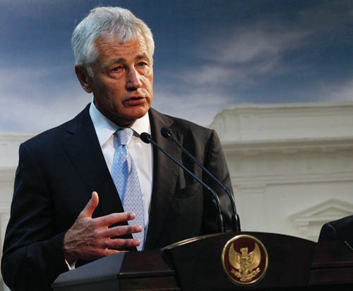 FILE - This Aug. 26, 2013 file photo shows Defense Secretary Chuck Hagel speaking in Jakarta, Indonesia. U.S. forces are now ready to act on any order by President Barack Obama to strike Syria, U.S. Hagel said Tuesday.The U.S. Navy has four destroyers in the eastern Mediterranean Sea positioned within range of targets inside Syria, as well as U.S. warplanes in the region, Hagel said in an interview with BBC television during his visit to the southeast Asian nation of Brunei. AP Photo/Achmad Ibrahim, File