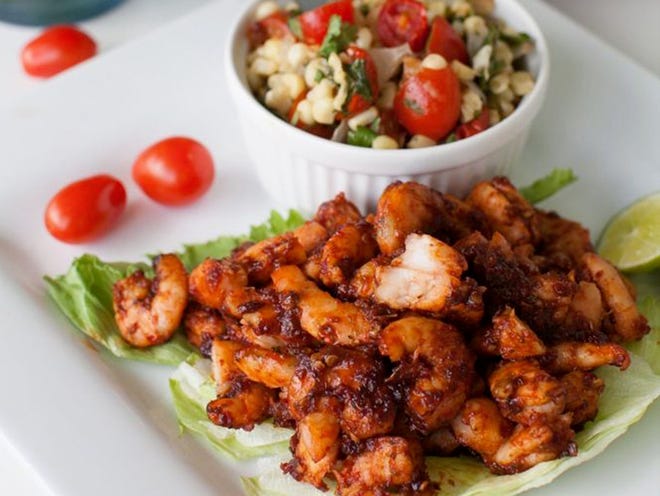 Creating a taco bar at home is no longer the realm of ready-to-go kits with spice packets and jarred sauces. Making your own versions is the way to go with fillings such as this shrimp in adobo alongside roasted corn, tomato and onion salsa.
(RENEE BROCK | ATLANTA JOURNAL-CONSTITUTION)