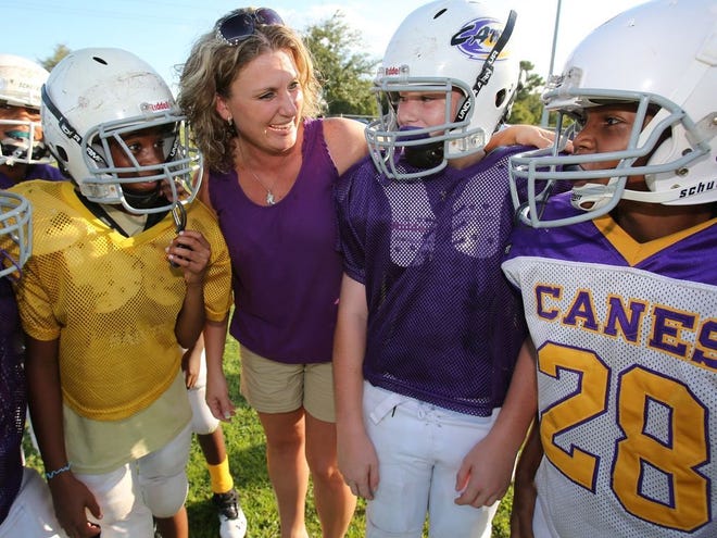 Susanne Jeffcoat, pictured in the photo above, has been a team mom for the past six seasons with the Marion County Youth Football League.