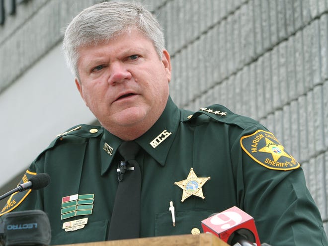Marion County Sheriff Chris Blair, shown in a file photo from his Jan. 8, 2013 swearing-in ceremony, has reduced his budget request, a major with his agency said Wednesday.