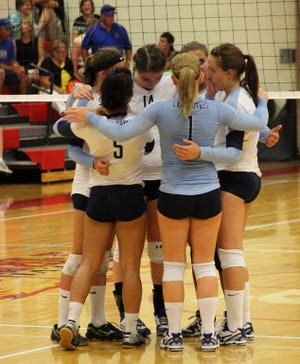 The LRSC volleyball team huddle up during Thursday night's match against Presentation College. The Royals went 3-0 on Wednesday in Thief River Falls, MN and are now 4-0 on the young season.