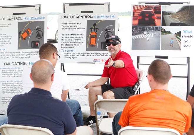 Don Winchester, instructor with Richard Petty Safe Driving Experience, lectures to students before they took the wheel on the road course at Bogue Airfield Wednesday.