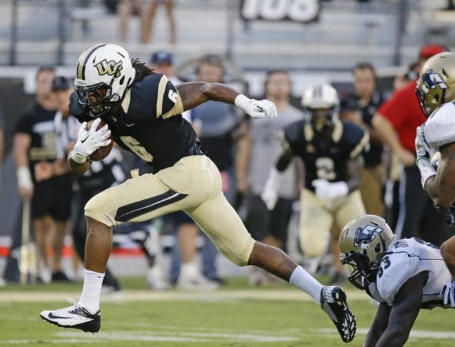 Central Florida wide receiver Rannell Hall (6) runs past Akron linebacker Jatavis Brown (53) for a touchdown during the first half of an NCAA college football game in Orlando, Fla., Thursday, Aug. 29, 2013.