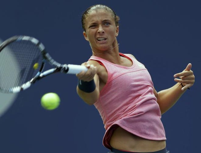 Sara Errani, of Italy, returns a shot to Flavia Pennetta, of Italy, during the second round of the 2013 U.S. Open tennis tournament, Thursday, Aug. 29, 2013, in New York.