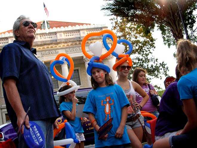 Children sport balloon hats made for them during a 2011 United Downtown event. The 2013 events begin Friday from 6 to 10 p.m. along First Street between University Avenue and Southeast Second Place.