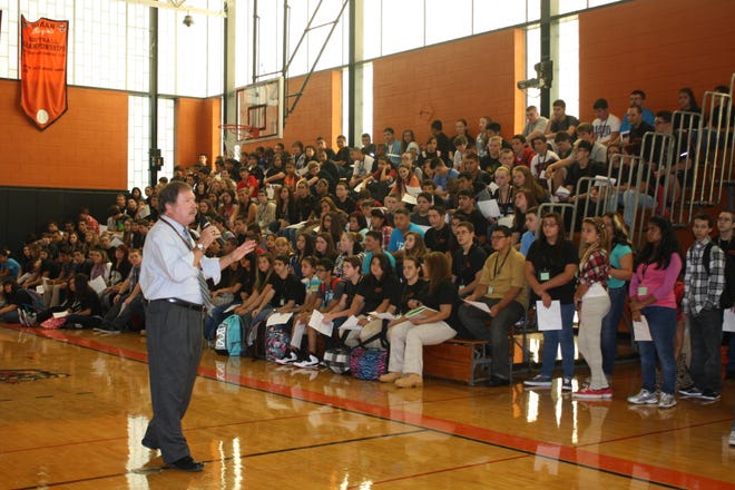 Principal Brian Bentley addresses freshmen and sophomores Wednesday morning on the first day of the school year at Diman Regional Vocational Technical High School.