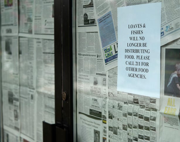 The sign at the Loaves & Fishes site in Burlington states the organization is closed, but a note issued Wednesday said it would be open until Sept. 30. So far, no one has provided information on which is correct.