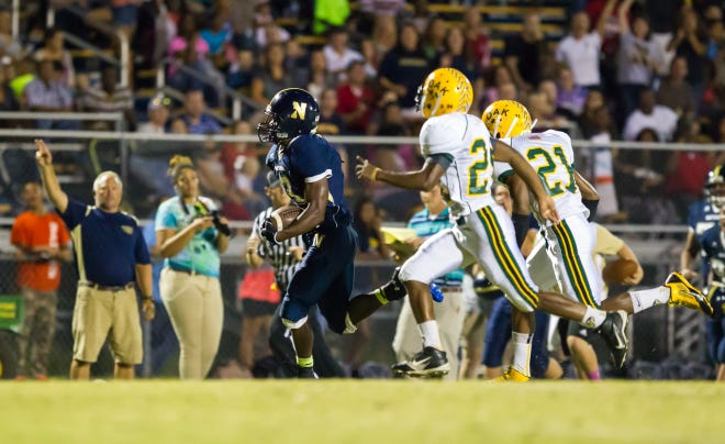 Northside's Famous Roberts runs for his 35-yard touchdown run Friday night.