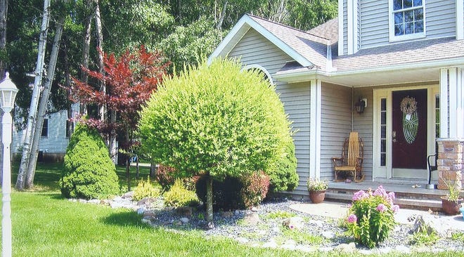 The Ilion Garden Club selected Jeremy and Kristen Rich’s yard at 161 Applewood Dr. as one of its Yard of the Month winners for July. PHOTO SUBMITTED