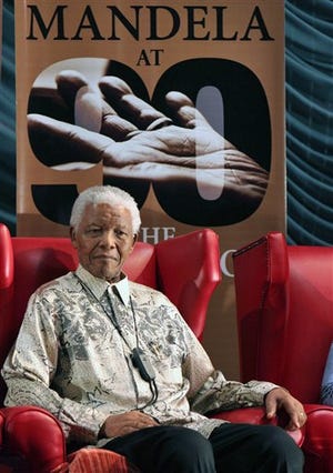 Former South African President Nelson Mandela at a news conference in Johannesburg, in this Wednesday, March, 5, 2008 file photo. Mandela has been discharged from hospital Sunday Sept. 1 2013, where he has been treated for months with a recurring lung infection. Mandela was released to his home in Johannesburg's Houghton suburb. (AP Photo/Denis Farrell, file)