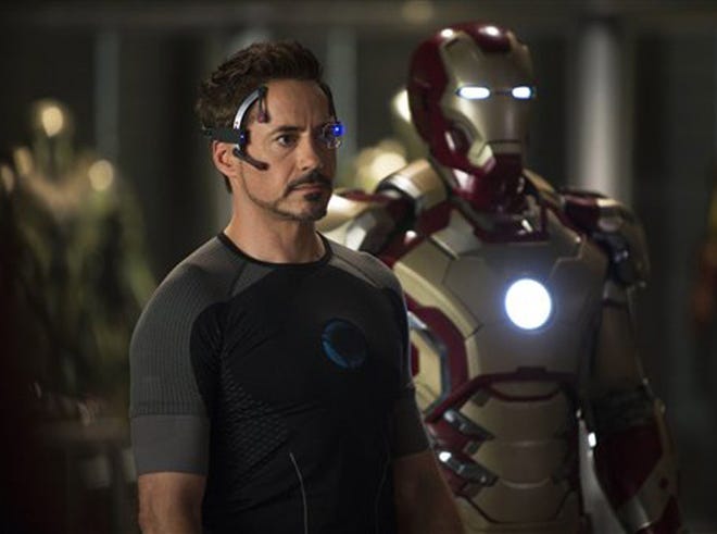 This undated publicity image released by Marvel shows Robert Downey Jr., as Tony Stark/Iron Man, in a scene from "Marvel's Iron Man 3." "Marvel's Iron Man 3" was one of several upcoming films to receive spotlight treatment with an ad that aired during Super Bowl XLVII on Sunday, Feb. 3, 2013.