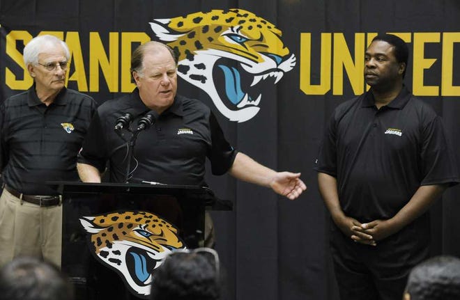 Bob.Self@jacksonville.com Jaguars President Mark Lamping is flanked by (left) Council president Bill Gulliford and Mayor Alvin Brown during Tuesday afternoon's Stand United announcement. Jaguars officials, the city and chamber announced efforts to create more fan engagement.
