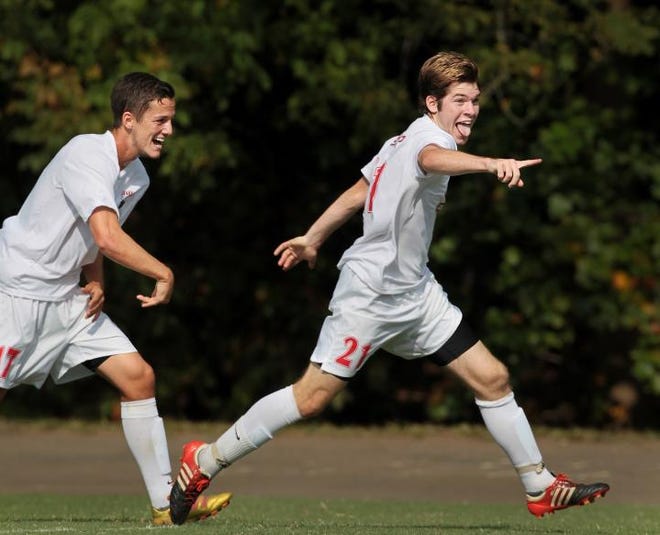 Belmont Abbey's Jay Nazari, right, and Zack Wertis celebrate after Nazari scored a goal against North Greenville during the soccer match at Belmont Abbey on Oct. 6, 2012.