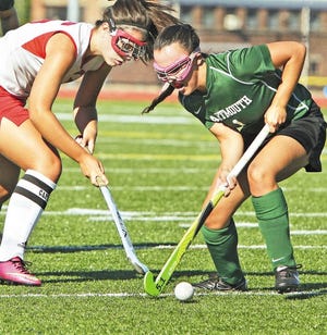 New Bedford's Bianca Melo, left, and Dartmouth's Elissa Tetrault battle for possession during Wednesday’s season-opener for both teams.
