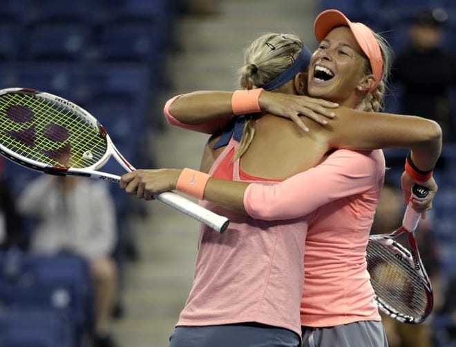 Lucie Hradecka, left, of the Czech Republic, celebrates with doubles partner Andrea Hlavackova, of the Czech Republic, after beating Venus and Serena Williams during the women's doubles semifinals of the 2013 U.S. Open tennis tournament, Friday, Sept. 6, 2013, in New York.
