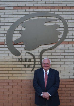 Photo courtesy of Effingham Health System Allen W. "Butch" Kieffer stands in front of a sign for the new "Kieffer Hall" at the hospital in Springfield. The community room at Effingham Health System was recently renamed in Kieffer's honor.