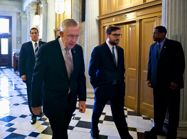 Senate Majority Leader Harry Reid of Nev. makes his way to the Senate floor on Capitol Hill in Washington, Friday, Sept. 6, 2013, to introduce a resolution to authorize military action to support President Barack Obama's request for a strike against Syria. (AP Photo/J. Scott Applewhite)