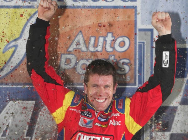 Carl Edwards celebrates after winning the NASCAR Sprint Cup Series race in Richmond, Va., on Saturday. (Zach Gibson | Associated Press)