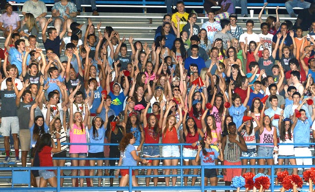 BRIAN D. SANDERFORD • TIMES RECORD The Southside High School student section cheers on the Rebels during their season opener against Rogers Heritage on Friday at Jim Rowland Stadium. Southside won the game 44-28. See page 1C for game story.