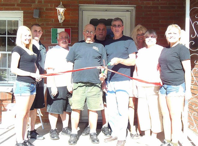 Celebrating the grand opening of Godfather’s Hideout at 213 Protection Ave., Herkimer, with a ribbon-cutting ceremony are, from left, Jacquelyn Hunt, Vito Carbone II, Jim Palumbo, Richard Carbone, Vito Carbone, owner; Bill Thompson, Beth Carbone, Bertha Thompson and Nicole Carbone. TELEGRAM/TIMES PHOTO/DONNA THOMPSON
