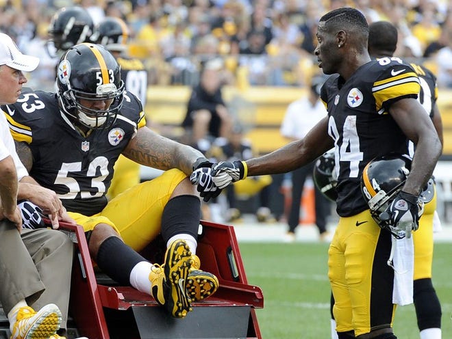 Pittsburgh Steelers center Maurkice Pouncey (53), is acknowledged by wide receiver Antonio Brown (84) as he is taken from the field after being injured in the first quarter an NFL football game against the Tennessee Titans, Sunday, Sept. 8, 2013, in Pittsburgh. (AP Photo/Don Wright)