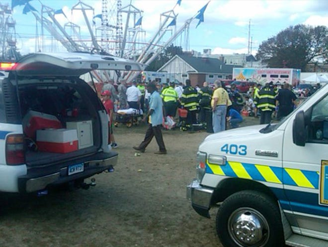 An amusement park ride malfunctioned Sunday Sept. 8, 2013 at the Norwalk Oyster Festival. Thirteen children were injured when a festival attraction that swings riders into the air lost power at a community fair in Connecticut but none of the injuries appeared to be life-threatening, authorities said. Most of the children suffered minor injuries and were treated at the Oyster Festival in Norwalk, police said. Norwalk Police Chief Thomas Kulhawik said there were initial reports of serious injuries but preliminary indications are that the injuries were not as severe as first feared. (AP Photo/ The Advocate, David Wells)