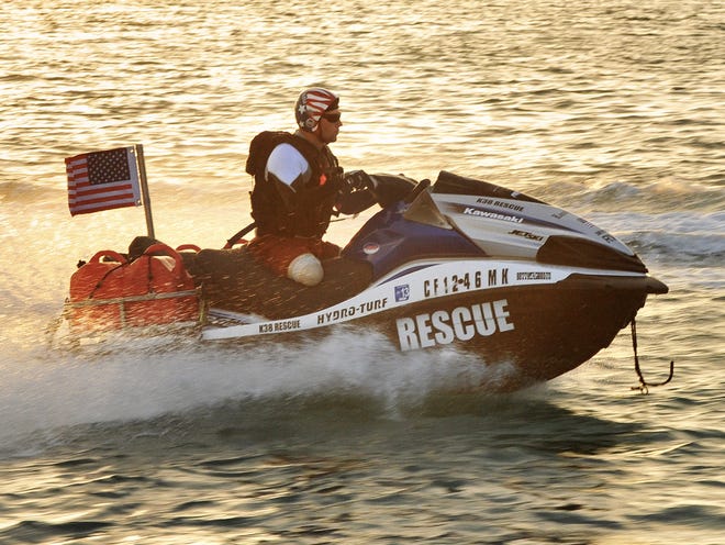 In this photo provided by the Florida Key News Bureau, Navy SEAL Bo Reichenbach, left, who lost both legs in a July 2012 Afghanistan combat explosion, pilots a personal watercraft on Friday, Sept. 6, 2013, in Key West, Fla. Reichenbach and other elite combat veterans are headed to New York City for a planned Sept. 11 arrival. The approximately 1,600-mile "Never Quit Challenge" voyage is to benefit three charities that assist military members, veterans and their families. Each personal watercraft has a team of riders, who will switch off during rest and refueling stops. (AP Photo/Florida Keys News Bureau, Rob O'Neal)