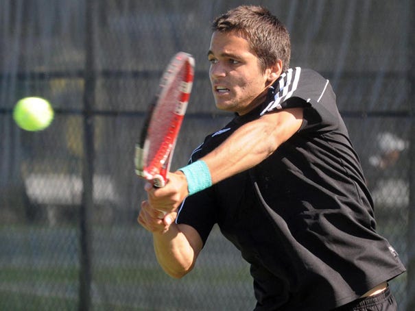 UNCW tennis player Rafael Aita competes against East Carolina University at UNCW on April 12, 2012.