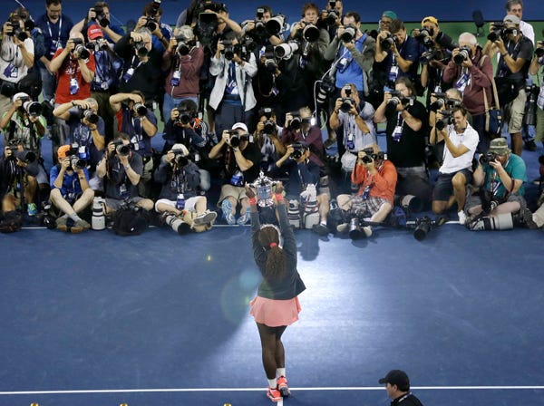 Serena Williams poses for photographers after beating Victoria Azarenka at the U.S. Open on Sunday.
(Mike Groll | Associated Press)