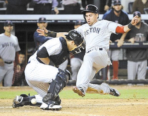 Jacoby Ellsbury scores the go-ahead run during the 10th inning of Thursday's win over the Yankees. Ellsbury has a broken right foot and it's unclear if he'll return this season.