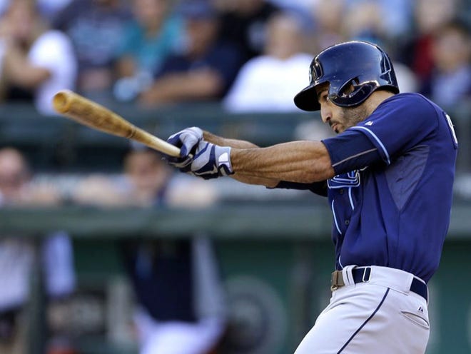 Tampa Bay Rays' Sean Rodriguez hits a two-run single against the Seattle Mariners in the eighth inning of a baseball game, Sunday, Sept. 8, 2013, in Seattle. (AP Photo/Ted S. Warren)