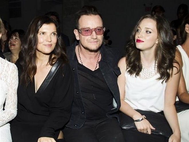 Bono and his wife Ali Hewson, left, and daugter Jordan Hewson attend the Edun collection on Sunday during Mercedes-Benz Fashion Week in New York. (Photo by Charles Sykes/Invision/AP)