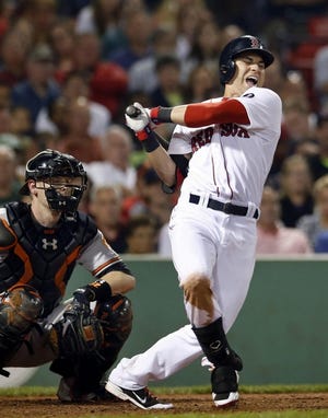 Boston Red Sox's Jacoby Ellsbury, right, reacts after fouling a ball off his foot as Baltimore Orioles catcher Matt Wieters watches during the seventh inning of a baseball game at Fenway Park in Boston, Wednesday, Aug. 28, 2013. (AP Photo/Elise Amendola) ORG XMIT: MAEA110