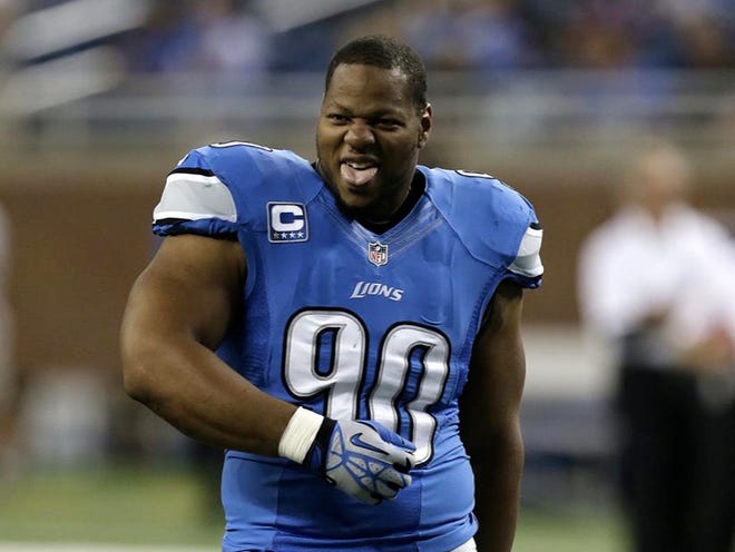 Lions defensive tackle Ndamukong Suh dances Sunday before the game against the Vikings. Suh probably wasn't smiling Tuesday after the NFL hit him with a $100,000 fine.
(PAUL SANCYA | THE ASSOCIATED PRESS)