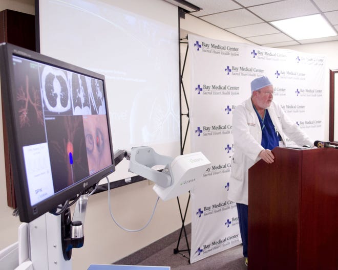 Dr. Reed Finney, a member of the team of physicians who spearheaded the effort, speaks at a press conference Wednesday.