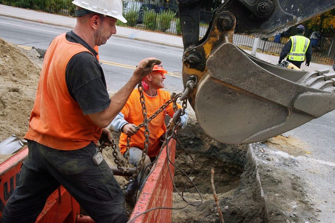 Contractors from ABCO Enterprises replace old lead water supply pipes, from the main line to the curb, with new copper lines for Providence Water along Broad Street in Providence in 2010.