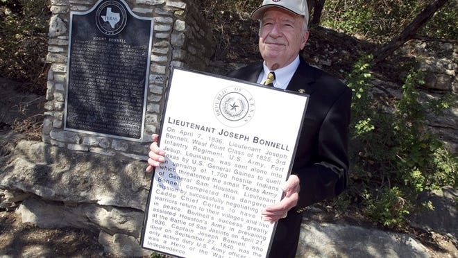 Sel Graham displays a replica of a historical marker from the grave of 1st Lt. Joseph Bonnell in front of a historical marker at Mount Bonnell on Friday, Sept. 23, 2011. Graham is the attorney for Stanley Bacon, of the West Point Society, who has filed suit against the Texas Historical Commission alleging that the commission unjustly denied his application to correct the marker at Mount Bonnell. Members of the society claim the marker should be dedicated to Lt. Joseph Bonnell, not George W. Bonnell. Deborah Cannon / AMERICAN-STATESMAN