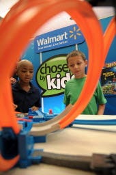 Two of about 1,000 boys and girls aged 18 months to 10 years play with a toy as part of a three-day Wal-Mart event during August in Dallas. The children chose their favorites, resulting in a top 20 list of kid-approved toys.
