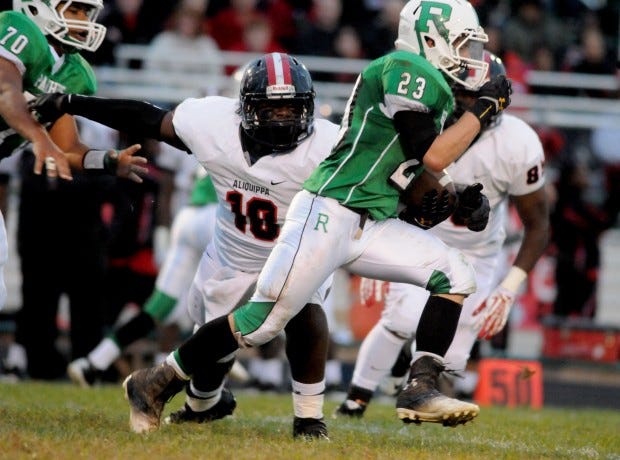 Riverside’s Dalton Hewitt (23) gets chased down by Aliquippa’s Donovan Cobb (18) during Friday’s game.