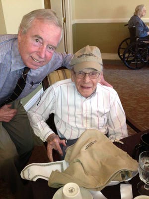 Times-Union Editor Frank Denton congratulates William Frank on his 104th birthday Wednesday,