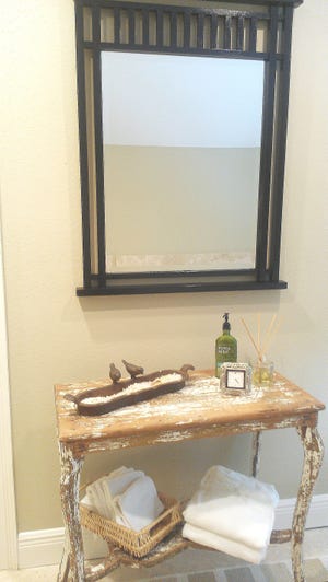 Contrast is key. It?s better to be really different than a little off. That?s why this distressed wood table pairs well with this sleek, black-framed mirror. Having the scale right is important, too.  - PROVIDED BY MARNI JAMESON